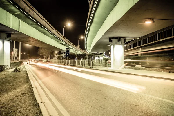 Light traces on traffic junctions at night — Stock Photo, Image