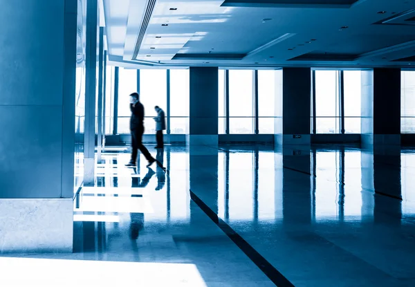 Image of silhouettes at morden office building — Stock Photo, Image