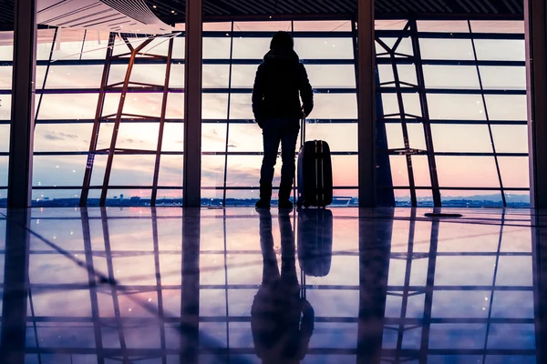 Traveler silhouettes at airport,Beijing — Stock Photo, Image