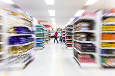 Empty supermarket aisle,motion blur clipart