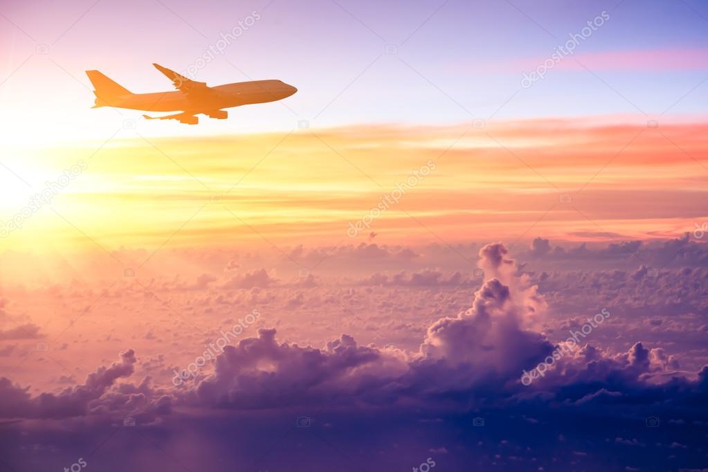 Airplane in the sky at sunrise