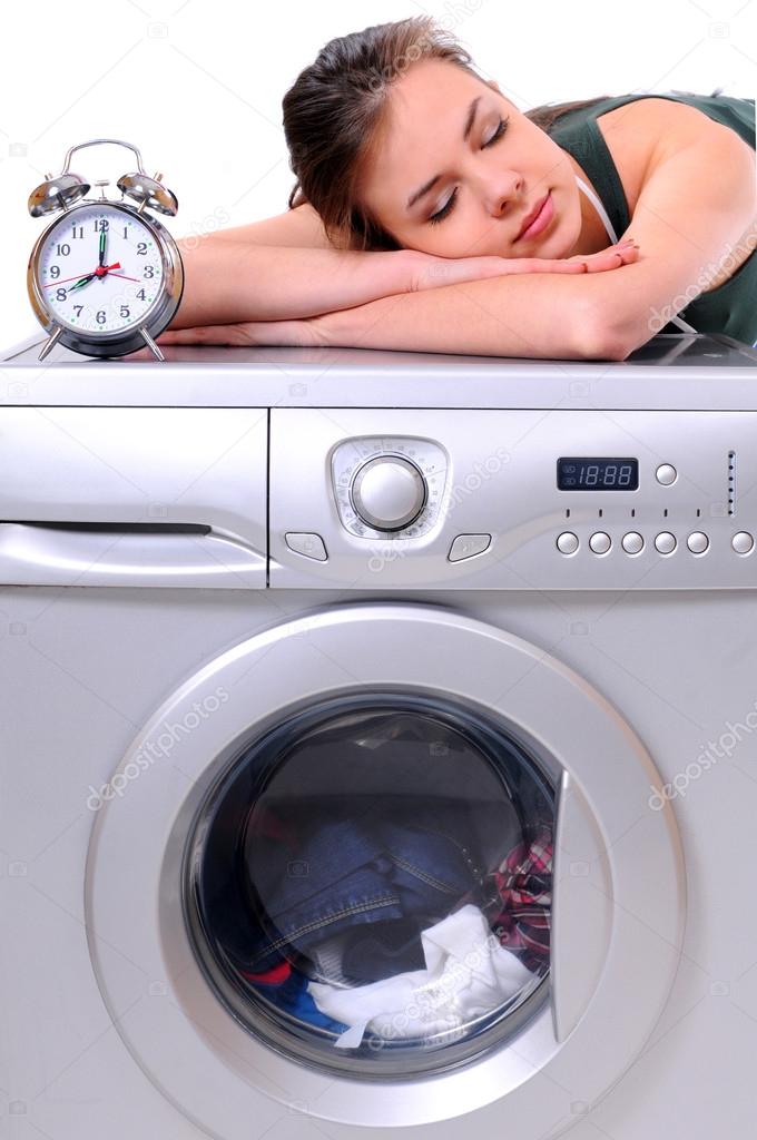 Woman sleeping on a washing machine