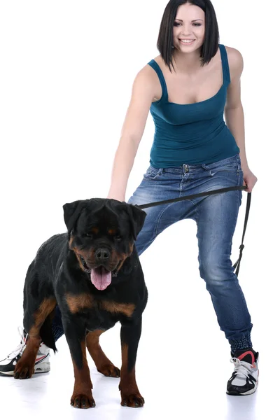 Woman with a Rottweiler dog Stock Photo