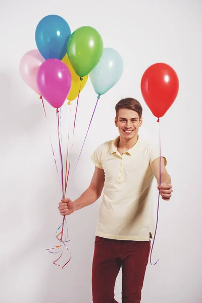 Young Man Colorful Balloons Standing Grey Background — Stock Photo, Image