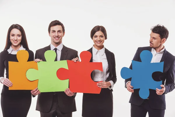 Image Four Confident Business People Wanting Put Pieces Puzzle Together — Stock Photo, Image