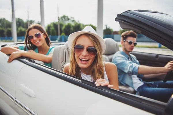 Three Friends Cabriolet Shot Outdoors Attractive Girls Smiling Camera While — Stock Photo, Image
