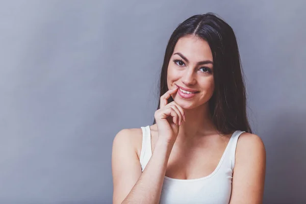 Beautiful Young Woman Posing Studio Expressing Emotions Looking Camera Gray — Stock Photo, Image