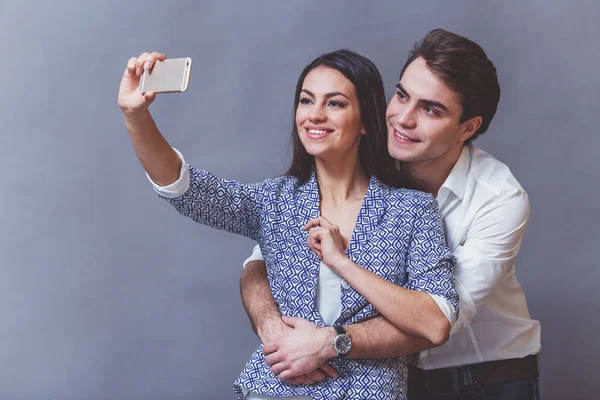 Young Beautiful Couple Doing Self Smile Look Camera Gray Background — Stock Photo, Image