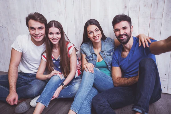 Group Attractive Young People Sitting Floor Doing Self Smiling Looking — Stock Photo, Image