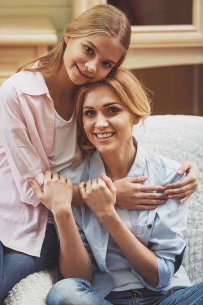 Lovely Teenage Girl Her Beautiful Mother Cuddling Looking Camera Smiling — Stock Photo, Image