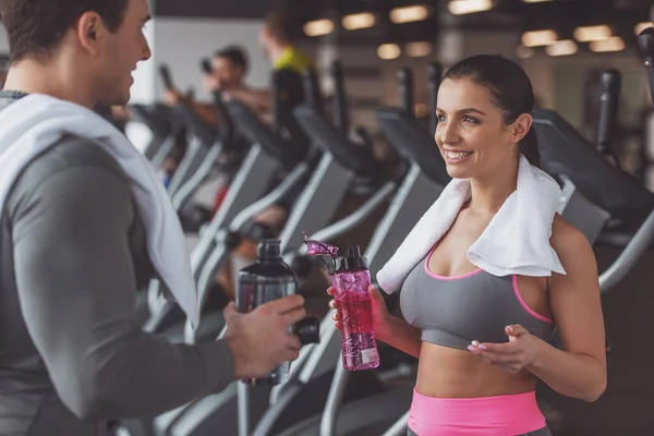 Attractive Young People Drinking Water Talking Smiling While Standing Gym — Stock Photo, Image