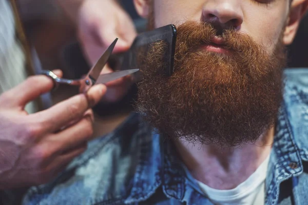 Attractive Muscled Bearded Barber Cutting Handsome Young Customer Beard Barber — Stock Photo, Image