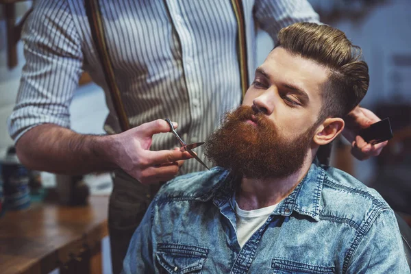 Attractive Muscled Bearded Barber Cutting Handsome Young Customer Beard Barber — Stock Photo, Image