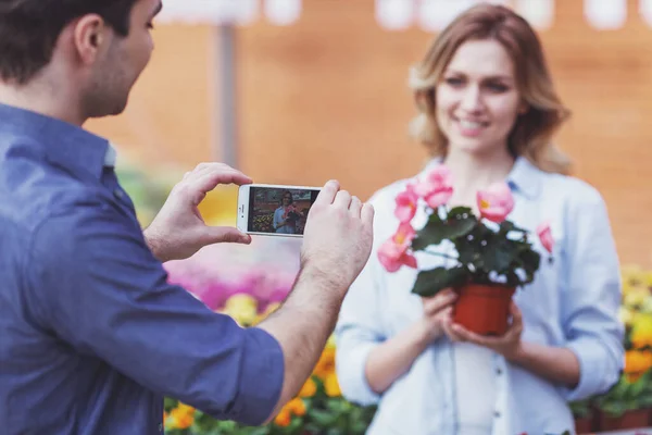 Man Making Photo His Beautiful Young Woman Holding Plant Orangery — Stock Photo, Image