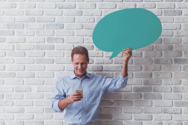 Handsome Middle Aged Man Holding Green Speech Bubble Using Smart — Stock Photo, Image