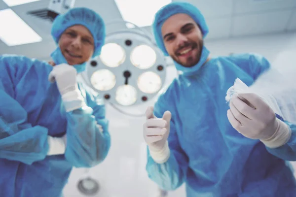 Two Surgeons Unbinding Patient Modern Operating Room Bottom View — Stock Photo, Image