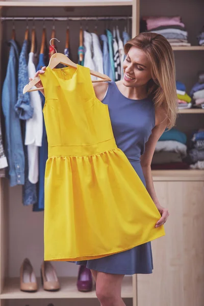 Beautiful Girl Cocktail Dress Smiling While Choosing Another Dress Her — Stock Photo, Image