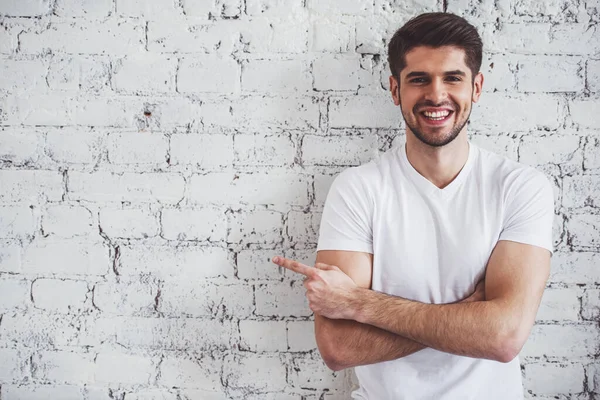 Handsome Young Man Pointing Away Looking Camera Smiling Standing White — Stock Photo, Image