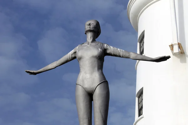 Lighthouse and diving belle statue — Stock Photo, Image