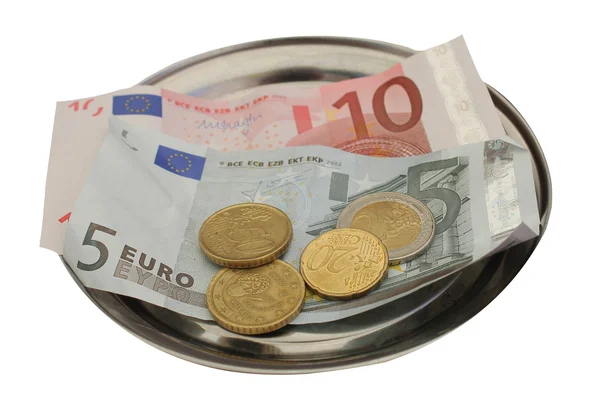 Euro dicas de dinheiro na bandeja de metal — Fotografia de Stock