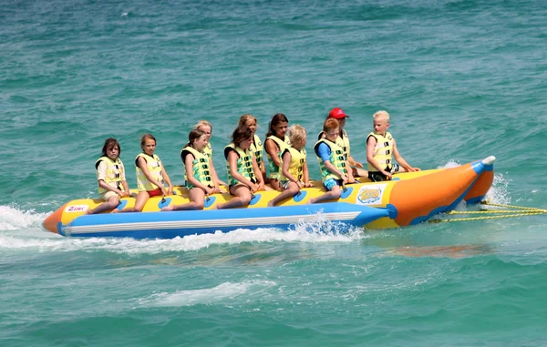 Children on banana boat ride — Stock Photo, Image