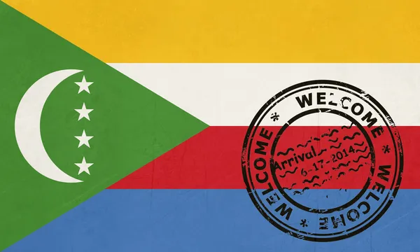 Vítejte na Komorská vlajka s pas razítkem — Stock fotografie