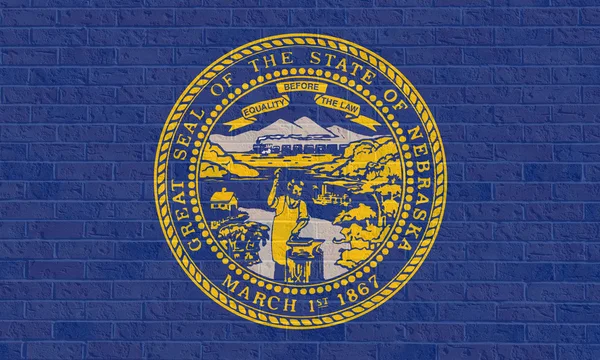 Nebraska state flag on brick wall — Stock Photo, Image