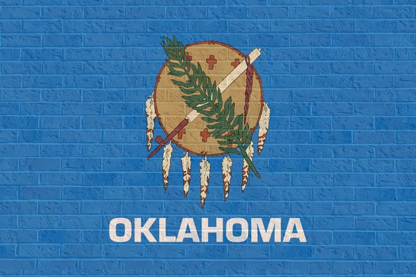 Vlajka státu Oklahoma na cihlovou zeď — Stock fotografie