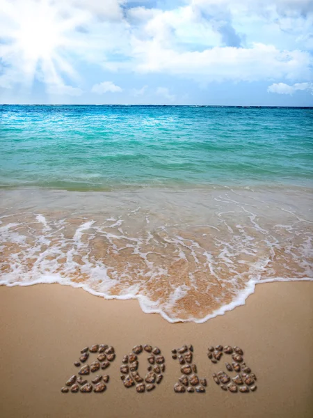 New Year 2013 is lined with pebbles on the beach. — Stock Photo, Image