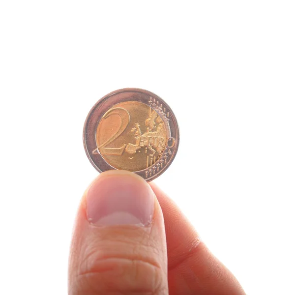 Hand met twee euro — Stockfoto