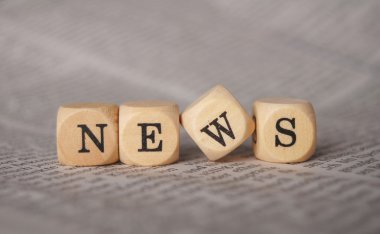 The word news on cubes clipart