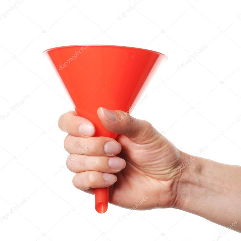Hand holding a funnel