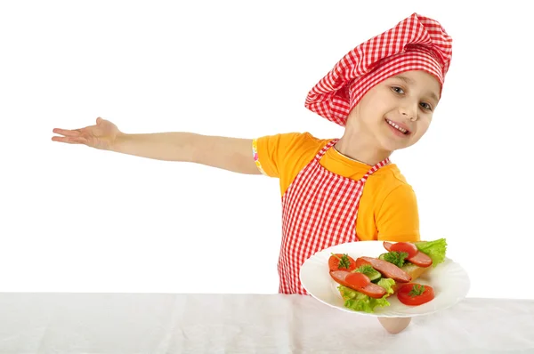 Pequeña niña sosteniendo plato con jamón — Foto de Stock