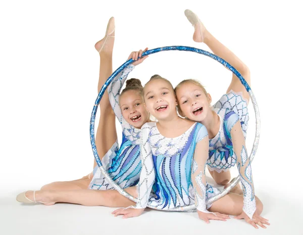 Little beautiful gymnasts with the hoop — Stock Photo, Image