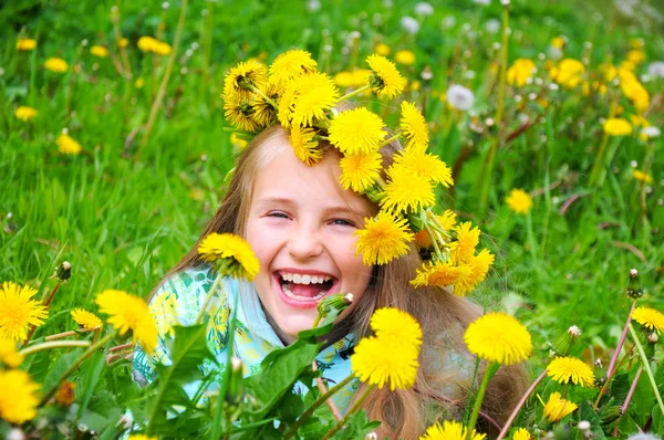 Little girl and yellow dandelion — Stock Photo, Image