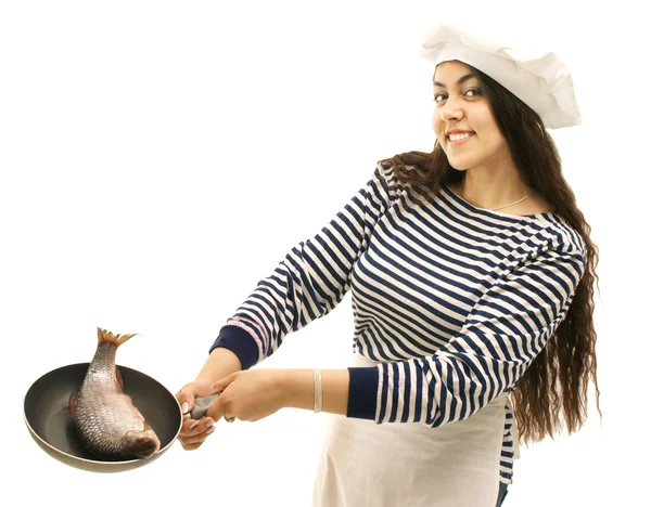 Giovane ragazza marinaio cucina pesci — Foto Stock