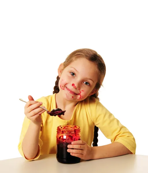 Menina comendo geléia caseira — Fotografia de Stock