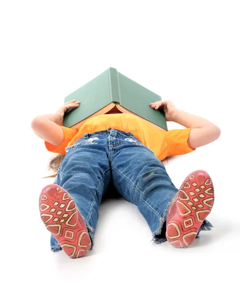 Child sleeping with book on her head — Stock Photo, Image