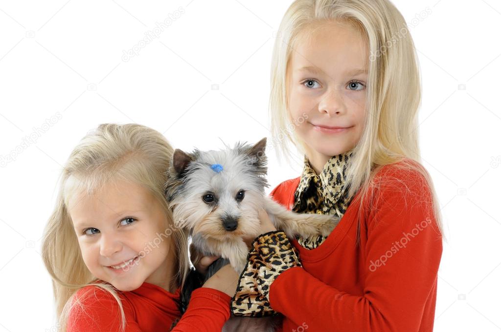 Two little sisters with dog