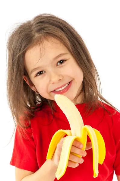 Meisje eten banaan — Stockfoto