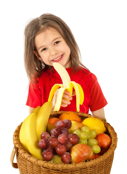 Little girl with basket of fruits — Stock Photo, Image