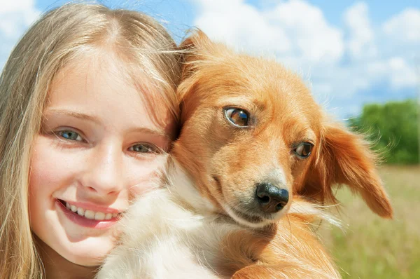 Girl and dog outdoors — Stok fotoğraf