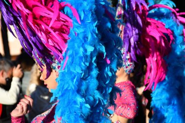 Torrevieja, Spain - February 20, 2022: Participants dressed in a carnival costumes during the traditional parade that celebrates the carnival festivities in the city. February 20, 2022 Spain