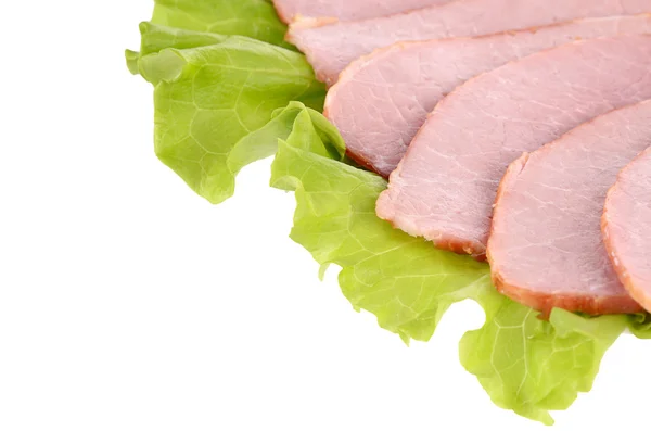 Slices of ham on green salad, isolated on a white background — Stock Photo, Image