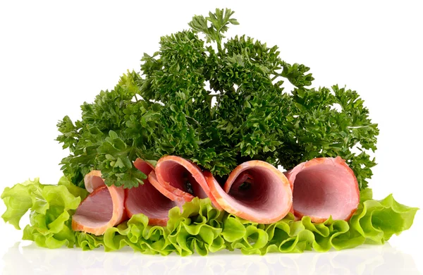 Slices of ham with parsley and salad leaf isolated on white bac — Stock Photo, Image