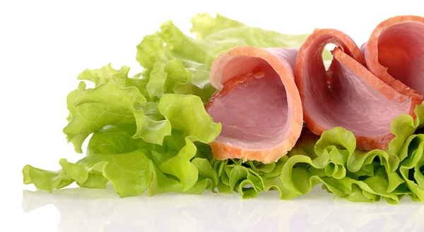 Slices of ham on green salad, isolated on a white background — Stock Photo, Image