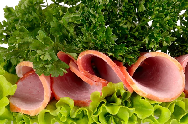 Slices of ham with parsley and salad leaf — Stock Photo, Image