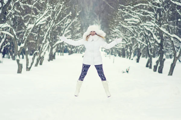 Winter portrait of beautiful smiling woman with snowflakes in wh — Stock Photo, Image