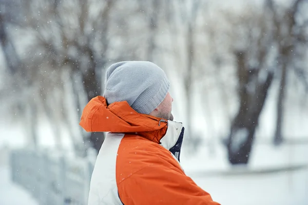 Handsome man in winter snow — Stock Photo, Image