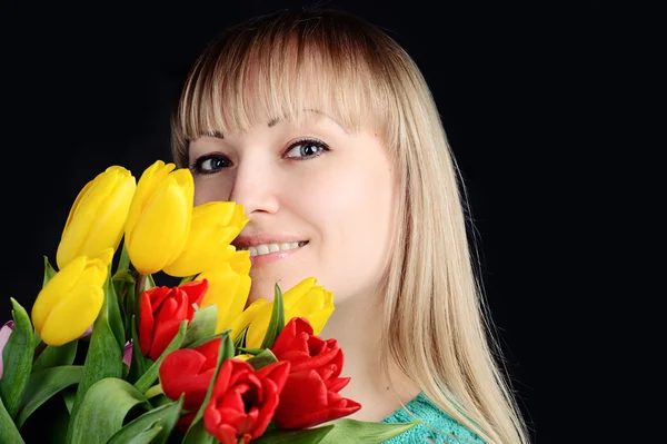 Beautiful attractive woman with colorful bouquet of fresh spring — Stock Photo, Image